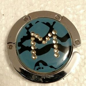 Purse hanger, folds up to carry in purse! Letter M